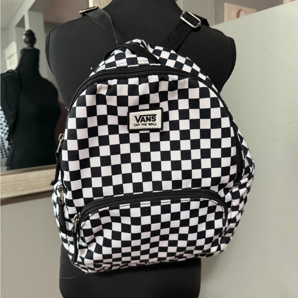 Vans Off The Wall mini backpack in a black and white checkerboard pattern